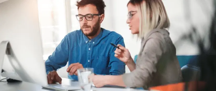 A-business-owners-looking-at-a-laptop-with-a-graph-of-their-business-plan